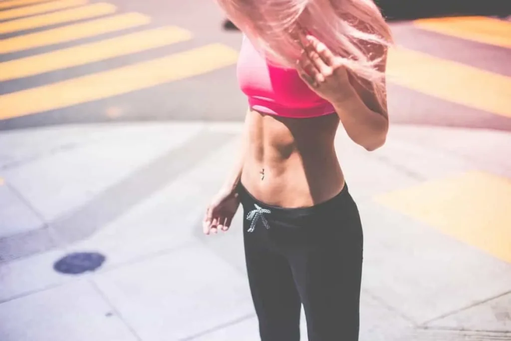 Woman with toned stomach after LA-EMS Body Sculpting Treatment West Ham
